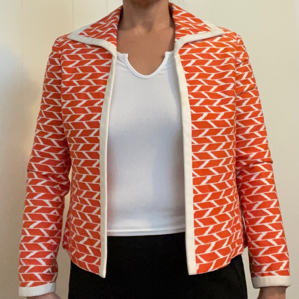 Orange and cream colored blazer